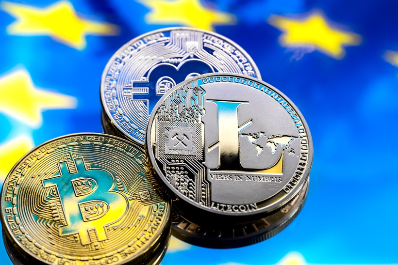 coins Bitcoin and litecoin, against the background of Europe and the European flag, the concept of virtual money, close up.